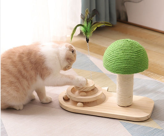 Cat playing with a wooden cat toy featuring a green top and feathers.